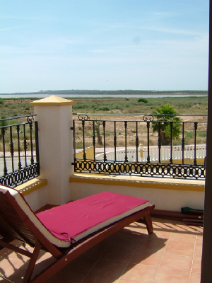 Balcony from main bedroom has two wooden loungers